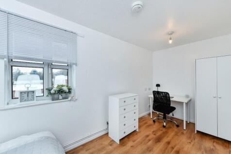 A bright and inviting double bedroom featuring ...