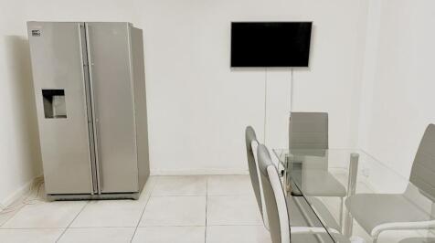 Modern kitchen featuring a sleek silver refrige...