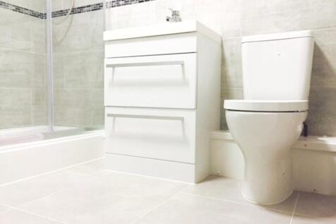A modern bathroom featuring sleek, clean lines ...