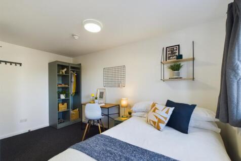 A bright and inviting double bedroom featuring ...