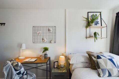 A stylish and inviting double bedroom featuring...