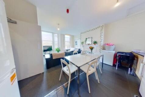 A bright and spacious kitchenette with modern f...