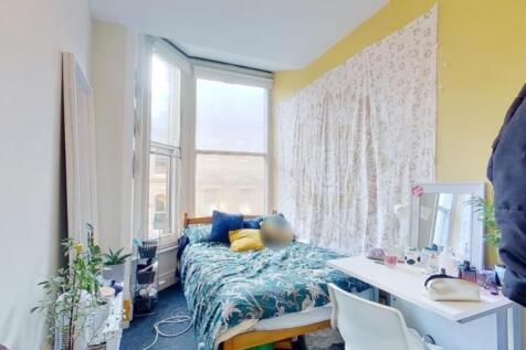 A bright and cozy double bedroom with ample nat...