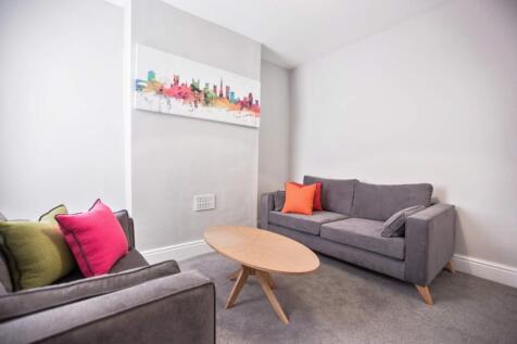 A modern and stylish living room featuring a co...