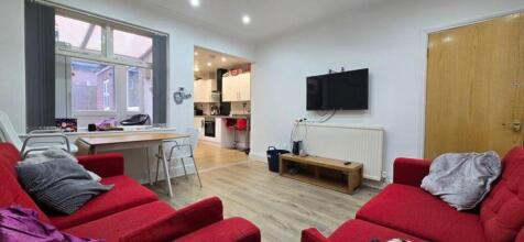 A spacious and bright large modern living room,...