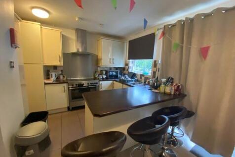 A bright and inviting kitchenette with modern a...