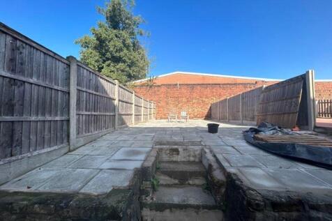 A spacious and well-lit garden area, perfect fo...