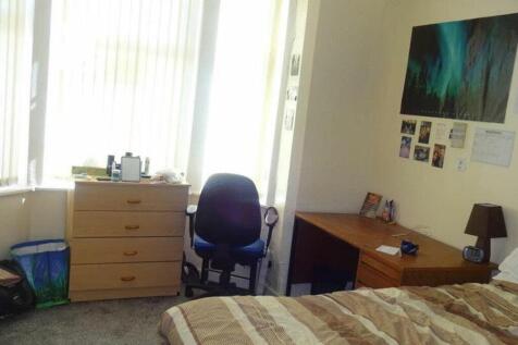 A bright and cozy double bedroom featuring ampl...