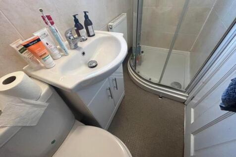 A tidy and functional bathroom featuring modern...