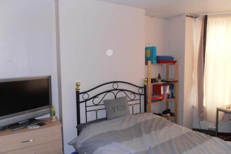 A cozy double bedroom with ample natural light ...
