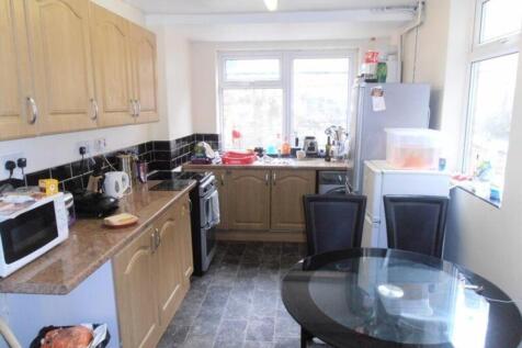 A spacious and functional kitchenette with ampl...