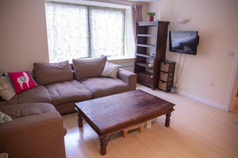 Bright and inviting living room featuring a com...