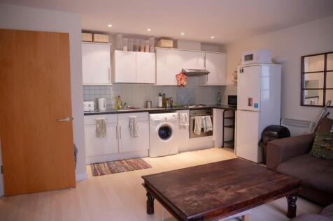 This modern kitchen features ample storage, a w...
