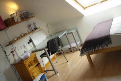 This charming double bedroom features a cozy la...