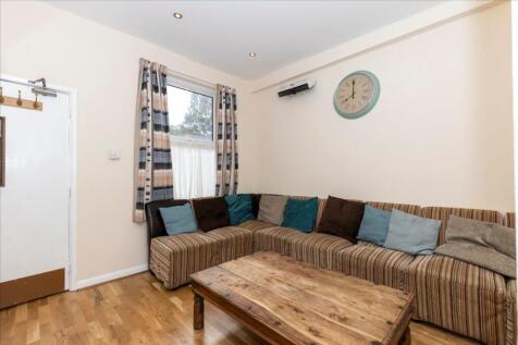 This inviting living room features a spacious a...