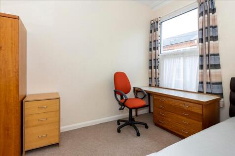 A bright and inviting double bedroom featuring ...