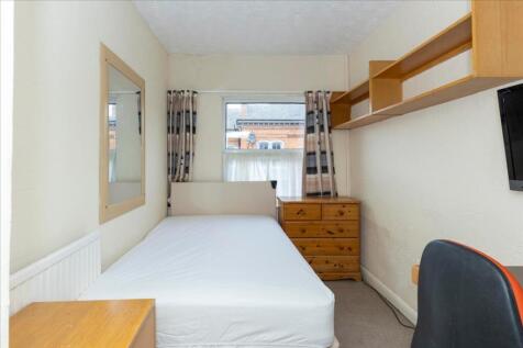 Bright and cozy double bedroom featuring a comf...
