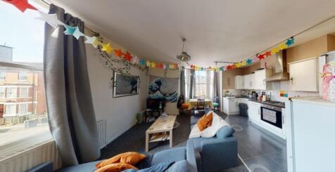 A bright and inviting living room featuring a s...