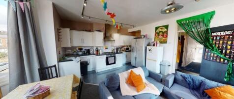 Bright and spacious kitchen area featuring mode...
