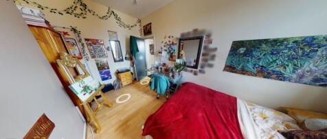 A cozy double bedroom featuring stylish decor, ...