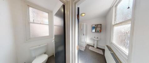 Bright and functional bathroom featuring a spac...