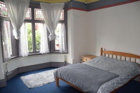A bright and inviting double bedroom featuring ...