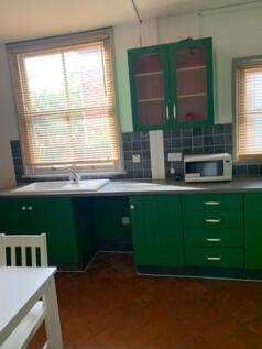 Bright and spacious kitchen featuring ample sto...