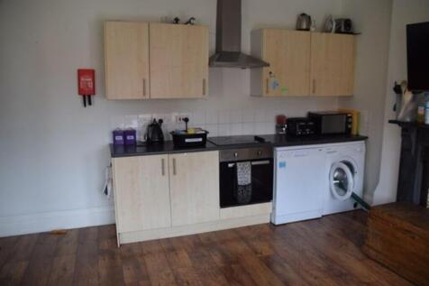 This well-equipped kitchen features ample cabin...
