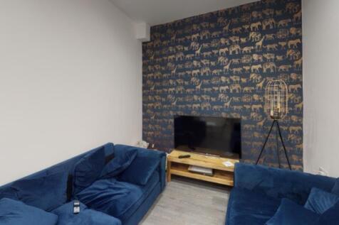 A stylish and spacious modern living room featu...