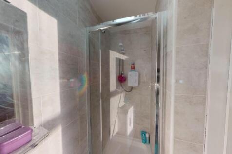 A bright and clean bathroom featuring modern fi...
