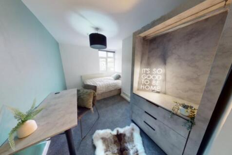 A stylish and inviting double bedroom featuring...