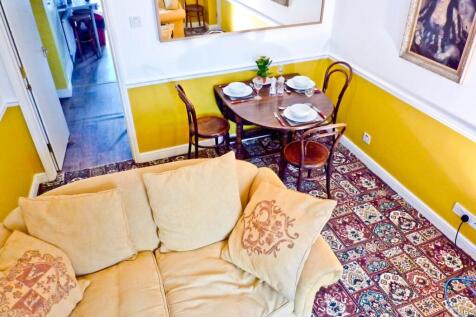A bright and inviting living room with comforta...