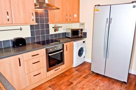 A spacious and well-equipped kitchen featuring ...