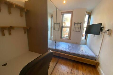 A bright and tidy double bedroom with ample nat...