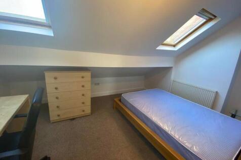 A bright and spacious double bedroom featuring ...