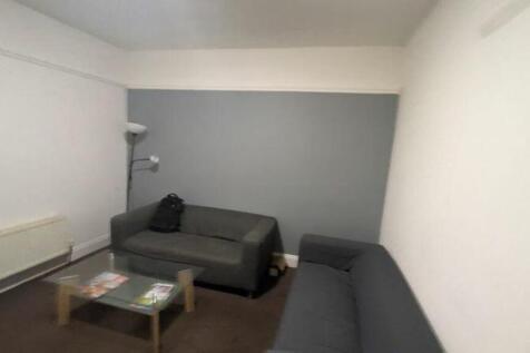A cozy living room with comfortable seating, pe...