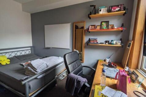 A cozy double bedroom with ample storage and a ...