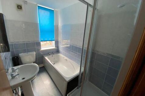 A spacious and clean bathroom featuring both a ...