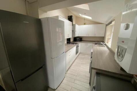 A spacious and well-equipped kitchen featuring ...