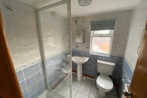 A clean and modern bathroom featuring a spaciou...