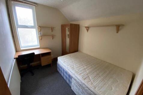 A bright and spacious double bedroom featuring ...