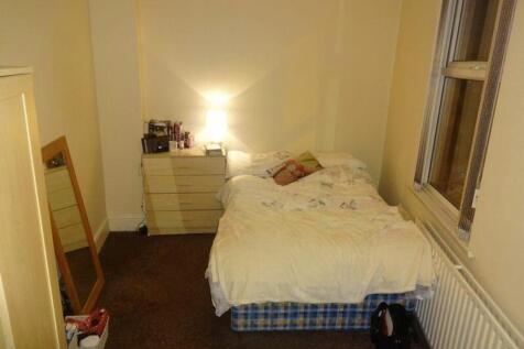 A cozy and inviting double bedroom, featuring a...