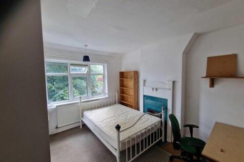 A bright and spacious double bedroom featuring ...