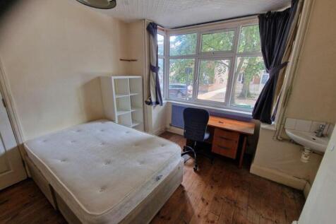 A bright and spacious double bedroom featuring ...