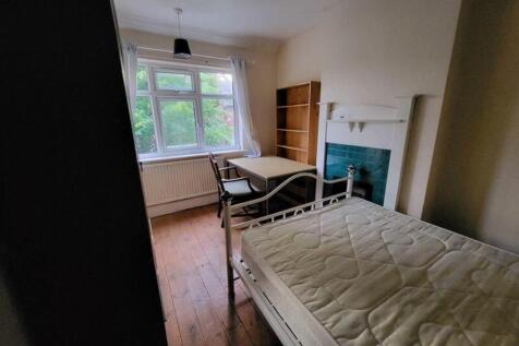 A bright and inviting double bedroom featuring ...
