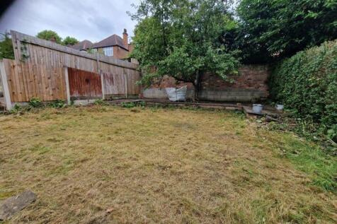 A spacious garden area with potential for relax...