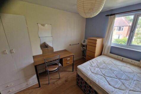 A spacious and inviting double bedroom featurin...