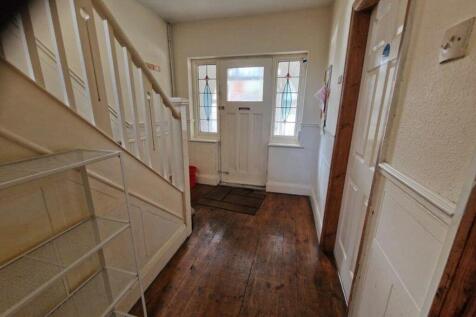 A welcoming hallway with a blend of character a...