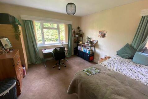A bright and spacious double bedroom with ample...