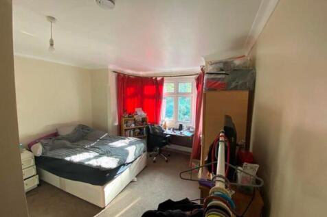 A bright and inviting double bedroom with ample...